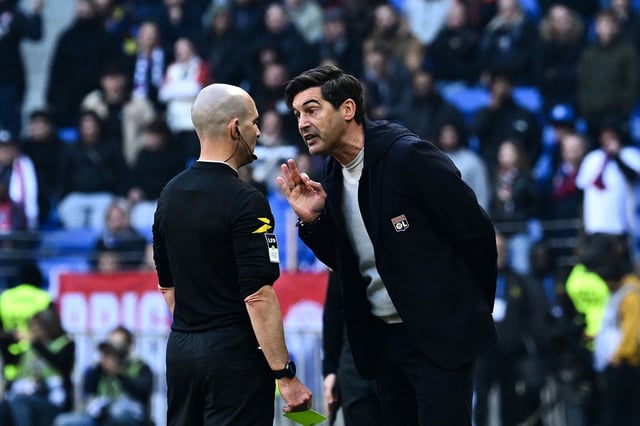 Lyon's head coach Paulo Fonseca confronts referee Benoit Millot during the French L1 football match between Olympique Lyonnais and Stade Brestois 29 at the Parc Olympique lyonnais in Decines-Charpieu, central-eastern France on March 2, 2025.