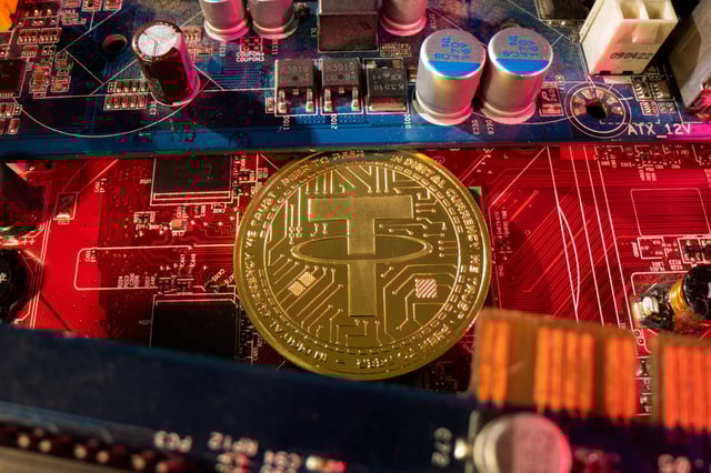 A representation of cryptocurrency Tether is placed on a PC motherboard, in this illustration taken June 16, 2023. REUTERS/Dado Ruvic/Illustration/File Photo