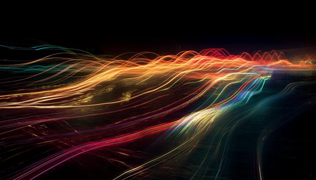 Glowing multi colored wave pattern on dark backdrop