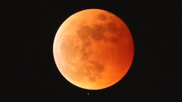 A total lunar eclipse over Tokyo, Japan on November 8, 2022.