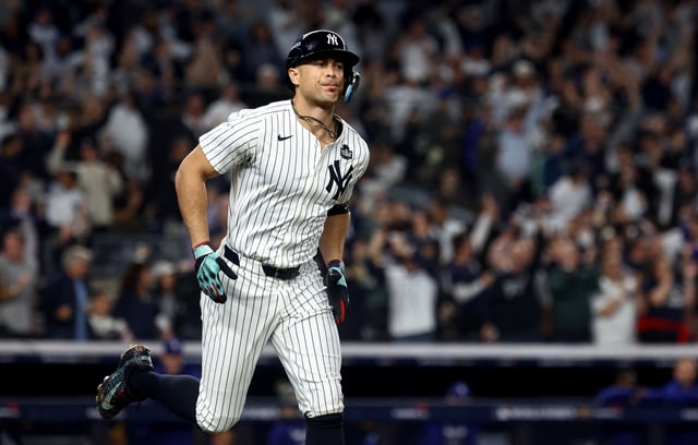 Oct 30, 2024; New York, New York, USA; New York Yankees designated hitter Giancarlo Stanton (27) reacts after hitting a home run during the third inning against the Los Angeles Dodgers in game five of the 2024 MLB World Series at Yankee Stadium. Mandatory Credit: Vincent Carchietta-Imagn Images/File Photo