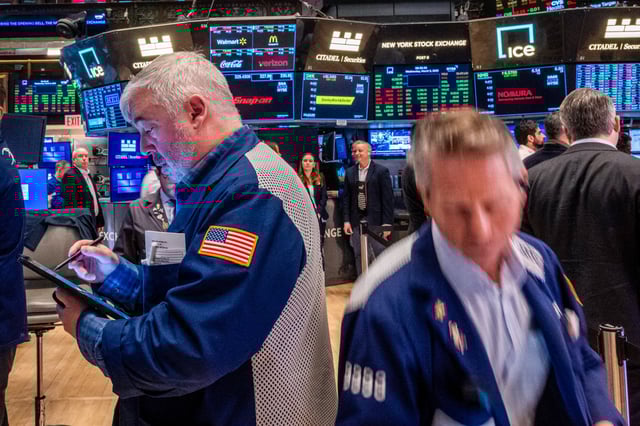 Traders work on the floor of the New York Stock Exchange on March 5, 2025, in New York City.