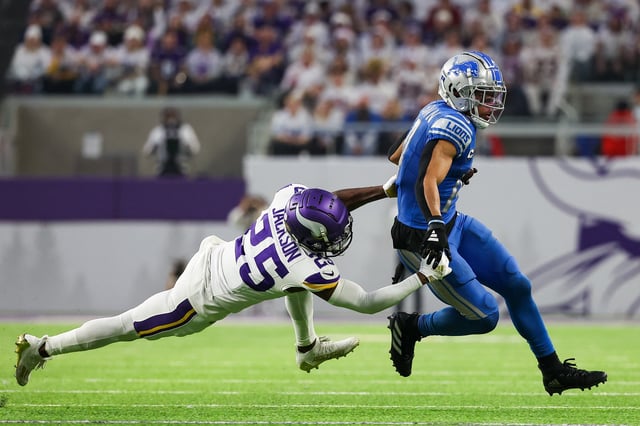 Dec 24, 2023; Minneapolis, Minnesota, USA; Detroit Lions wide receiver Amon-Ra St. Brown (14) runs the ball after a catch while Minnesota Vikings safety Theo Jackson (25) defends during the fourth quarter at U.S. Bank Stadium. Mandatory Credit: Matt Krohn-USA TODAY Sports/File Photo