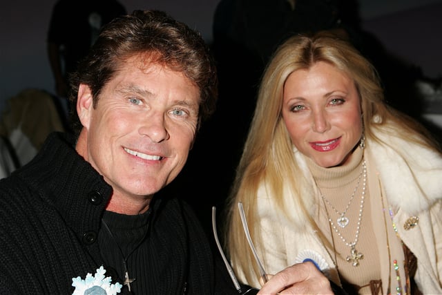 David Hasselhoff posed with his then-wife, actress Pamela Bach-Hasselhoff, before the 2005 Hollywood Christmas Parade on November 27, 2005 in California.