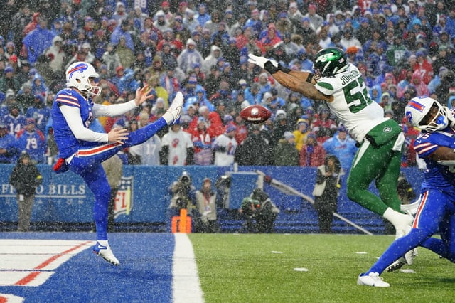 Dec 11, 2022; Orchard Park, New York, USA; New York Jets defensive end Jermaine Johnson (52) blocks a punt by Buffalo Bills punter Sam Martin (8) during the second half at Highmark Stadium. Mandatory Credit: Gregory Fisher-USA TODAY Sports/File Photo