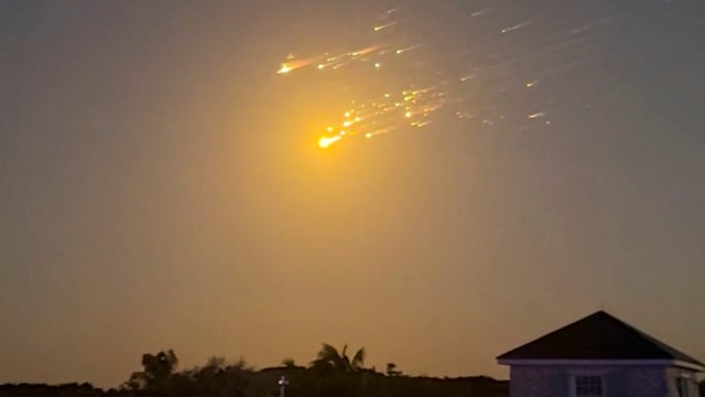 A view shows debris streaking through the sky, after SpaceX's Starship spacecraft tumbled and exploded in space, in Big Sampson Kay, Bahamas, March 6, 2025, in this screen grab obtained from social media video.