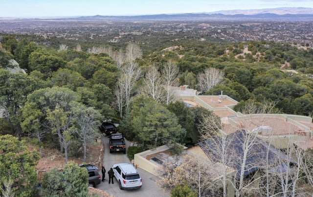 Santa Fe County deputies remain outside the house belonging to actor Gene Hackman and his wife Betsy Arakawa were earlier found dead, Thursday, Feb. 27, 2025 in Santa Fe, N.M. (AP Photo/Roberto E. Rosales)
