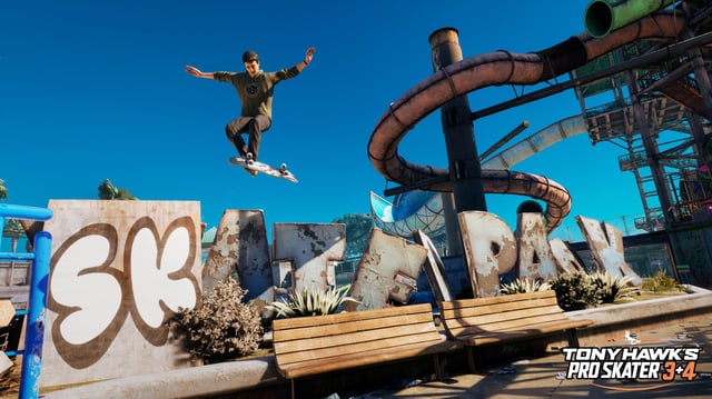 A skater doing a kickflip over a graffitied water park sign in Tony Hawk&#39;s Pro Skater 3+4.