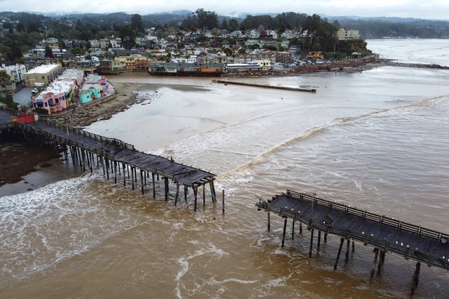 A wharf in Capitola, Calif., was broke during a storm in early 2023. Powerful storm systems slammed California in late 2022 and early 2023, with thousands of people impacted by power outages, road closures, downed trees, landslides and flooding. 