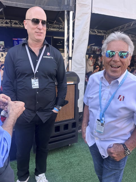 Dan Towriss, the new owner of Andretti Global, laughs with Mario Andretti before the IndyCar Series season-opening race Sunday March 2, 2025, in St. Petersburg, Fla. (AP Photo/Jenna Fryer)