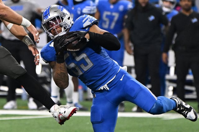 Jan 21, 2024; Detroit, Michigan, USA; Detroit Lions linebacker Derrick Barnes (55) intercepts a pass intended for Tampa Bay Buccaneers tight end Cade Otton (88) during the second half in a 2024 NFC divisional round game at Ford Field. Mandatory Credit: Lon Horwedel-USA TODAY Sports/File Photo