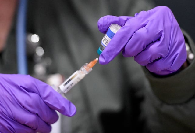 Sherry Andrews prepares a MMR vaccine at the City of Lubbock Health Department in Lubbock, Texas, U.S. February 27, 2025. Andrews has been working for five years with the department. REUTERS/Annie Rice/File Photo