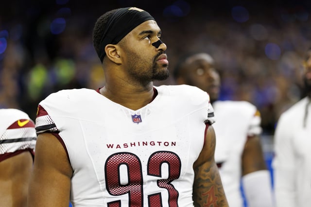 DETROIT, MICHIGAN - JANUARY 18: Defensive tackle Jonathan Allen #93 of the Washington Commanders stands on the sidelines during the national anthem prior to the NFC Divisional Playoff game against the Detroit Lions, at Ford Field on January 18, 2025 in Detroit, Michigan.