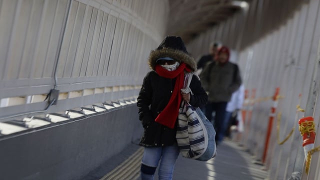Pedestrians cross at the entrance to the Paso del Norte International Bridge in Ciudad Juarez, Mexico, on February 1, 2025, where North American authorities carry out mass deportations of migrants handed over to personnel from Mexico's National Migration Institute. Photo: Gerardo Vieyra/NurPhoto via Getty Images