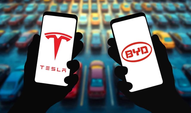 Which electric vehicle giant has a better battery? (gguy/Shutterstock)