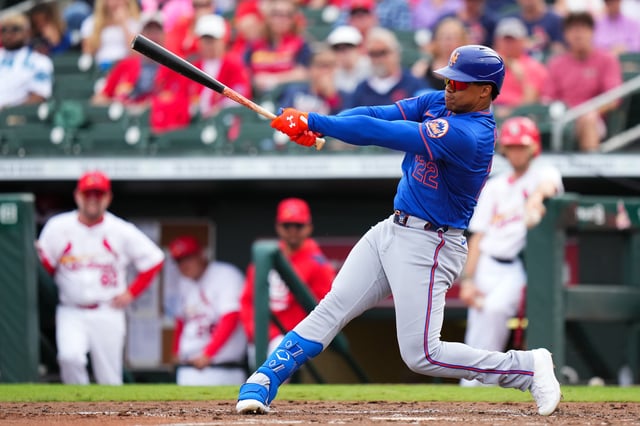 Juan Soto #22 of the New York Mets hits a single against the St. Louis Cardinals /d3i of a spring training game at Roger Dean Stadium on February 24, 2025 in Jupiter, Florida.
