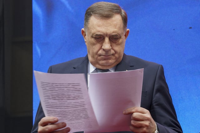 Bosnian Serb President Milorad Dodik watches ruling by the court after a court sentenced him to one year in prison and banned him from engaging in politics for six years over his separatist actions, during a rally in the Bosnian town of Banja Luka, 240 kms northwest of Sarajevo, Wednesday, Feb. 26, 2025. (AP Photo/Radivoje Pavicic)
