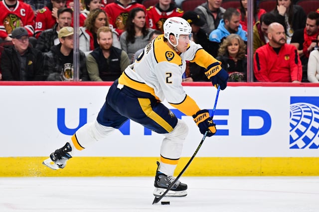 Feb 7, 2025; Chicago, Illinois, USA; Nashville Predators defenseman Luke Schenn (2) passes the puck against the Chicago Blackhawks during the third period at the United Center. Mandatory Credit: Daniel Bartel-Imagn Images/File Photo