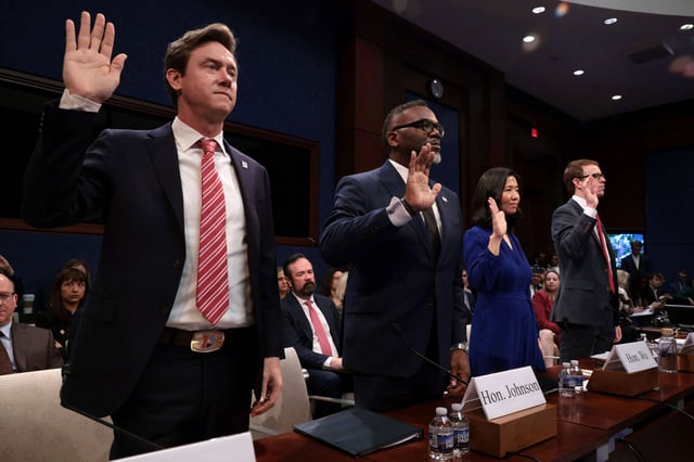 From left: Denver Mayor Michael Johnston, Chicago Mayor Brandon Johnson, Boston Mayor Michelle Wu and David J. Bier, Director of Immigration Studies at the Cato Institute, are sworn in during a House Oversight and Government Reform Committee hearing on sanctuary cities' policies at the U.S. Capitol on March 5, 2025, in Washington, D.C.