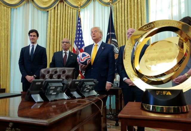 President Donald Trump and President of Fédération Internationale de Football Association (FIFA) Gianni Infantino pose with fellow FIFA officials after Trump signed an executive order in the Oval Office on Friday. Trump signed an executive order establishing a White House task force for the 2026 World Cup. (Getty Images/Anna Moneymaker)