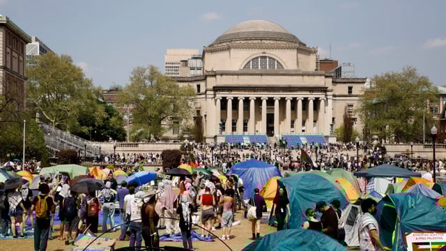 Student protesters gather inside their encampment on the Columbia University campus, April 29, 2024, in New York