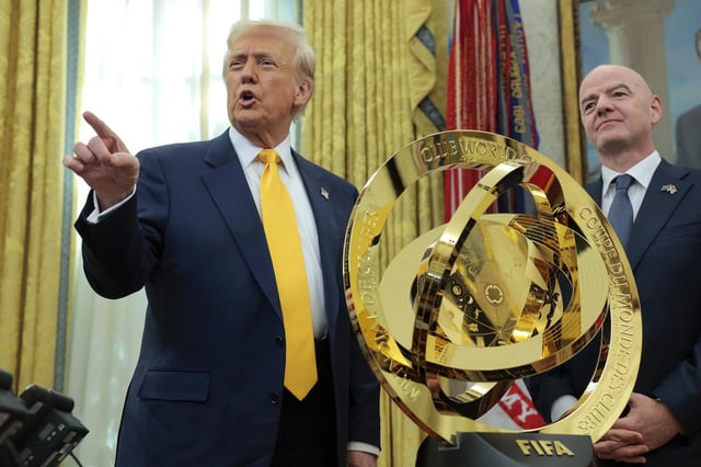 President Donald Trump speaks alongside FIFA President Gianni Infantino after unveiling the 2025 Club World Cup trophy in the Oval Office on March 7, 2025.