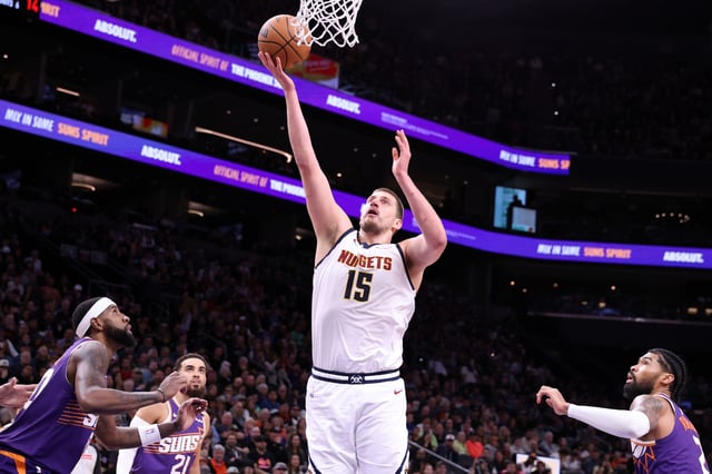 Nikola Jokic #15 of the Denver Nuggets attempts a layup during the first half against the Phoenix Suns at Footprint Center on February 08, 2025 in Phoenix, Arizona.