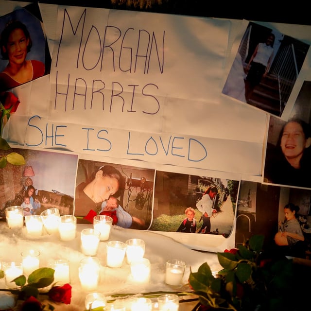 A memorial with photos of Morgan Harris attached is shown as family and friends gather at a vigil in Winnipeg, Thursday, Dec. 1, 2022. Remains found in a Winnipeg-area landfill have been identified as Harris. THE CANADIAN PRESS/John Woods
