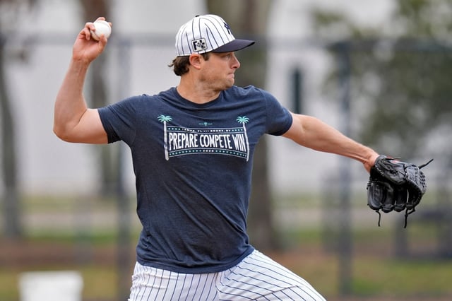 New York Yankees pitcher Gerrit Cole throws to second base doing pickoff drills during a spring training baseball workout Thursday, Feb. 20, 2025, in Tampa, Fla. (AP Photo/Chris O’Meara)
