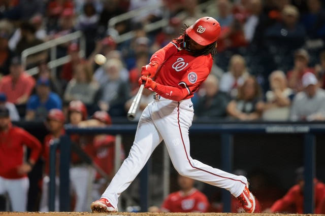 Mar 7, 2025; West Palm Beach, Florida, USA; Washington Nationals shortstop CJ Abrams (5) hits a solo home run against the New York Mets during the third inning at CACTI Park of the Palm Beaches. Mandatory Credit: Sam Navarro-Imagn Images