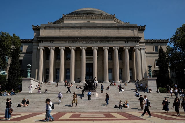 People walk through Columbia University in New York City, U.S., September 4, 2024. REUTERS/Adam Gray/File Photo
