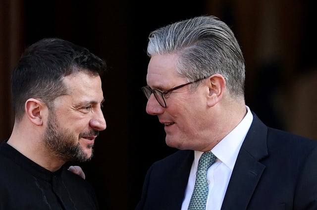 British Prime Minister Keir Starmer greets Ukrainian President Volodymyr Zelenskiy on the day of the European leaders' summit to discuss European security and Ukraine, at Lancaster House in London, Britain, March 2, 2025. REUTERS/Toby Melville/Pool/File Photo