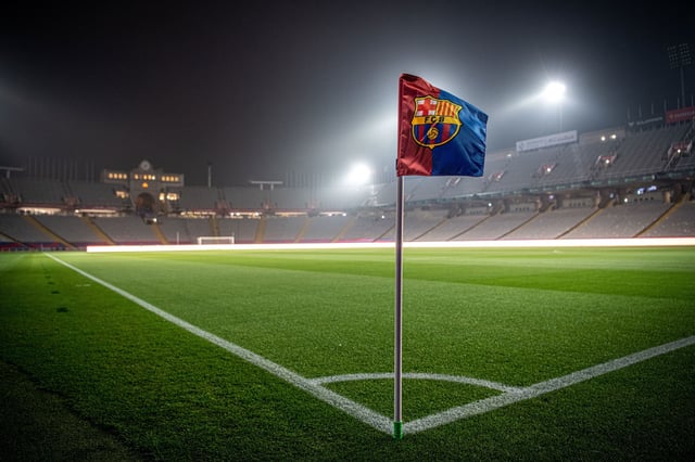 BARCELONA, SPAIN - MARCH 08, 2025: A corner flag bearing the logo of FC Barcelona before the La Liga EA Sports match between FC Barcelona and CA Osasuna at Estadi Olimpic Lluis Companys in Barcelona, Spain, on March 8, 2025.