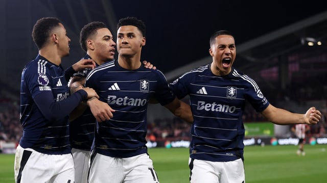 Watkins, centre, kept his celebrating to a minimum after scoring against his former club