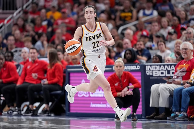 Caitlin Clark #22 of the Indiana Fever brings the ball up court during the first half of a game against the Washington Mystics at Gainbridge Fieldhouse on June 19, 2024 in Indianapolis, Indiana.
