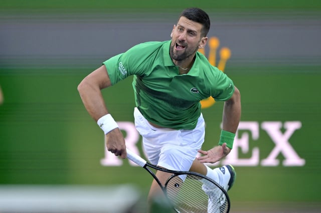 Mar 8, 2025; Indian Wells, CA, USA;  Novak Djokovic (SRB) hits a shot against Botic Van De Zandschulp (not pictured) during the second round of the BNP Paribas Open at the Indian Well Tennis Garden. Mandatory Credit: Jayne Kamin-Oncea-Imagn Images