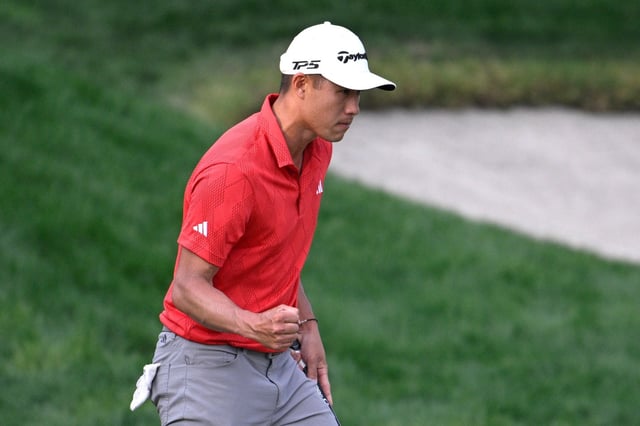 Collin Morikawa pumps his fist after making a putt for birdie and the lead on the 18th green during the third round of the Arnold Palmer Invitational at Bay Hill on Saturday.  (AP Photo/Phelan M. Ebenhack)