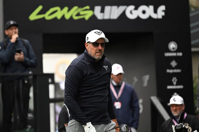 LIV team HYFLYERS GC player Phil Mickelson from the USA watches his tee shot on day one of the LIV Golf tournament at Fanling golf club in Hong Kong on March 7, 2025.