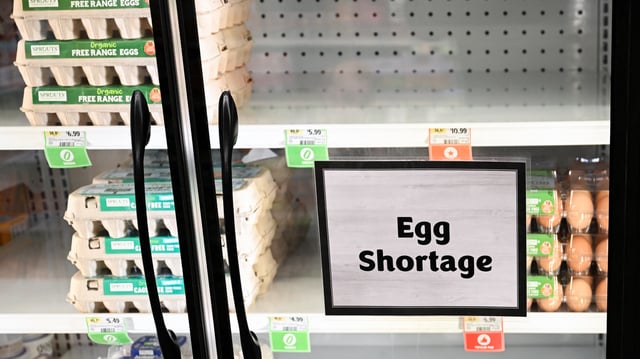 Egg shortage signage is displayed on partially empty shelves at a Sprouts Farmer&#39;s Market grocery store in Lawndale, California on January 2, 2025.