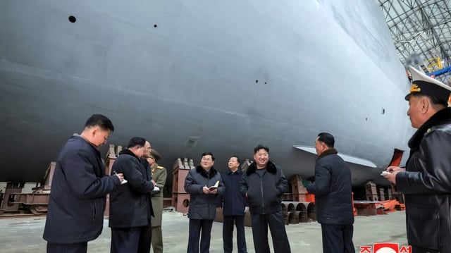 Kim Jong-un was photographed at a shipyard in an undisclosed location on Saturday during a visit to ensure that “the incomparably overwhelming warships fulfil their mission”