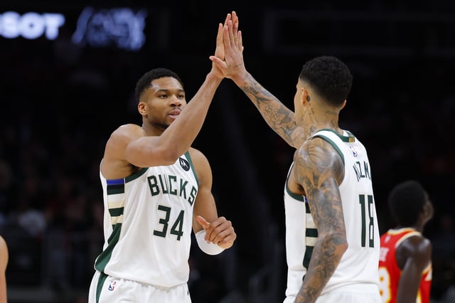 Giannis Antetokounmpo #34 reacts with Kyle Kuzma #18 of the Milwaukee Bucks during the fourth quarter against the Atlanta Hawks at State Farm Arena on March 4, 2025 in Atlanta, Georgia.