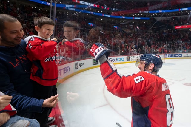 WASHINGTON, DC - MARCH 9: Alex Ovechkin #8 of the Washington Capitals celebrates with his son Sergei after the team wins a game against the Seattle Kraken at Capital One Arena on March 9, 2025 in Washington, D.C. (Photo by Jess Rapfogel/NHLI via Getty Images)