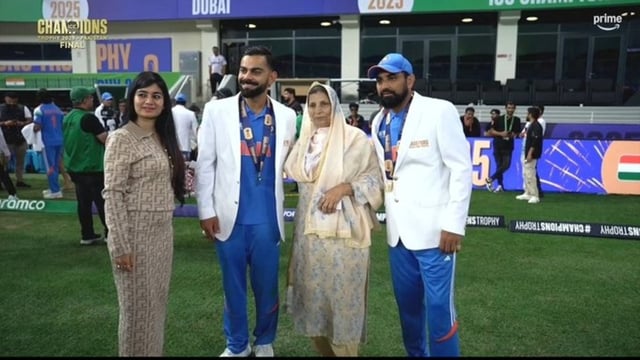 Virat Kohli takes a picture with Mohammed Shami and his family.