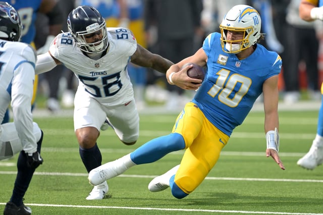 Nov 10, 2024; Inglewood, California, USA;  Los Angeles Chargers quarterback Justin Herbert (10) is stopped by Tennessee Titans linebacker Harold Landry III (58) after a first down in the first half at SoFi Stadium. Mandatory Credit: Jayne Kamin-Oncea-Imagn Images/File Photo