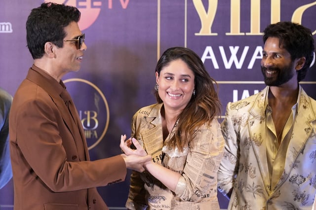 Bollywood personalities Karan Johar, left, and Kareena Kapoor Khan share a lighter moment as actor Shahid Kapoor, right, looks on, on the first day of the International Indian Film Academy (IIFA) awards in Jaipur, India, Saturday, March 8, 2025. (AP Photo/Deepak Sharma)