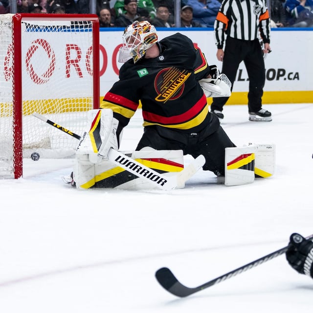 Dallas Stars' Mikael Granlund (64) scores on Vancouver Canucks goaltender Kevin Lankinen (32) during second period NHL hockey action in Vancouver, B.C., Sunday, March 9, 2025. THE CANADIAN PRESS/Ethan Cairns