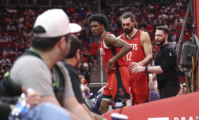 Mar 8, 2025; Houston, Texas, USA;  Houston Rockets forward Amen Thompson (1) limps off the court after an apparent injury during the fourth quarter against the New Orleans Pelicans at Toyota Center. Mandatory Credit: Troy Taormina-Imagn Images