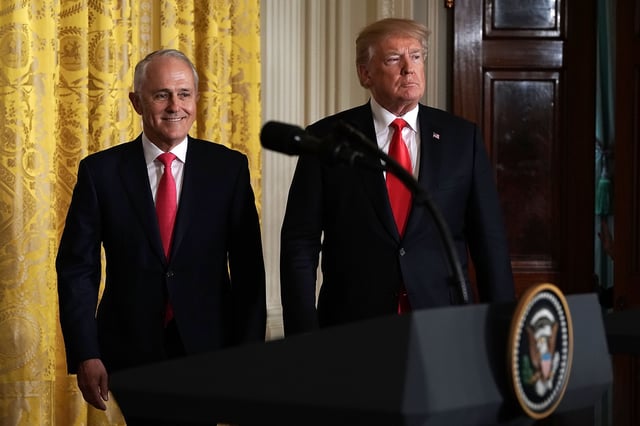 Donald Trump (R) and Malcolm Turnbull (L) walk towards podiums for a joint news conference in the East Room of the White House February 23, 2018 in Washington, D.C.