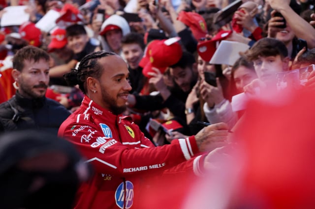 Formula One F1 - Ferrari presents new driving pairing Lewis Hamilton and Charles Leclerc to the public - Milan, Italy - March 6, 2025 Ferrari's Lewis Hamilton signs his autograph for fans during the presentation REUTERS/Claudia Greco/File Photo
