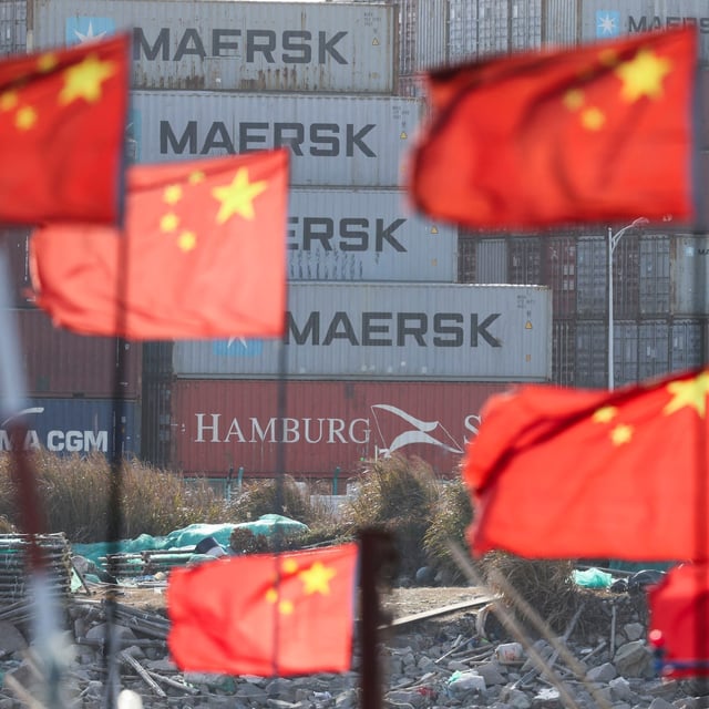 Chinese national flags flutter near shipping containers at the Yangshan Port outside Shanghai, China, February 7, 2025.  REUTERS/Go Nakamura
